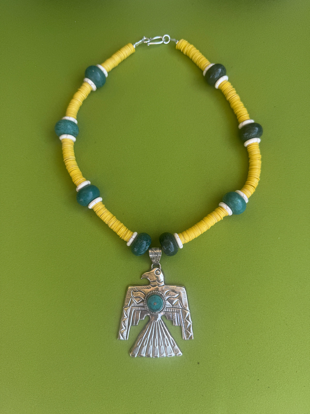 Thunderbird necklace with yellow vynal beads